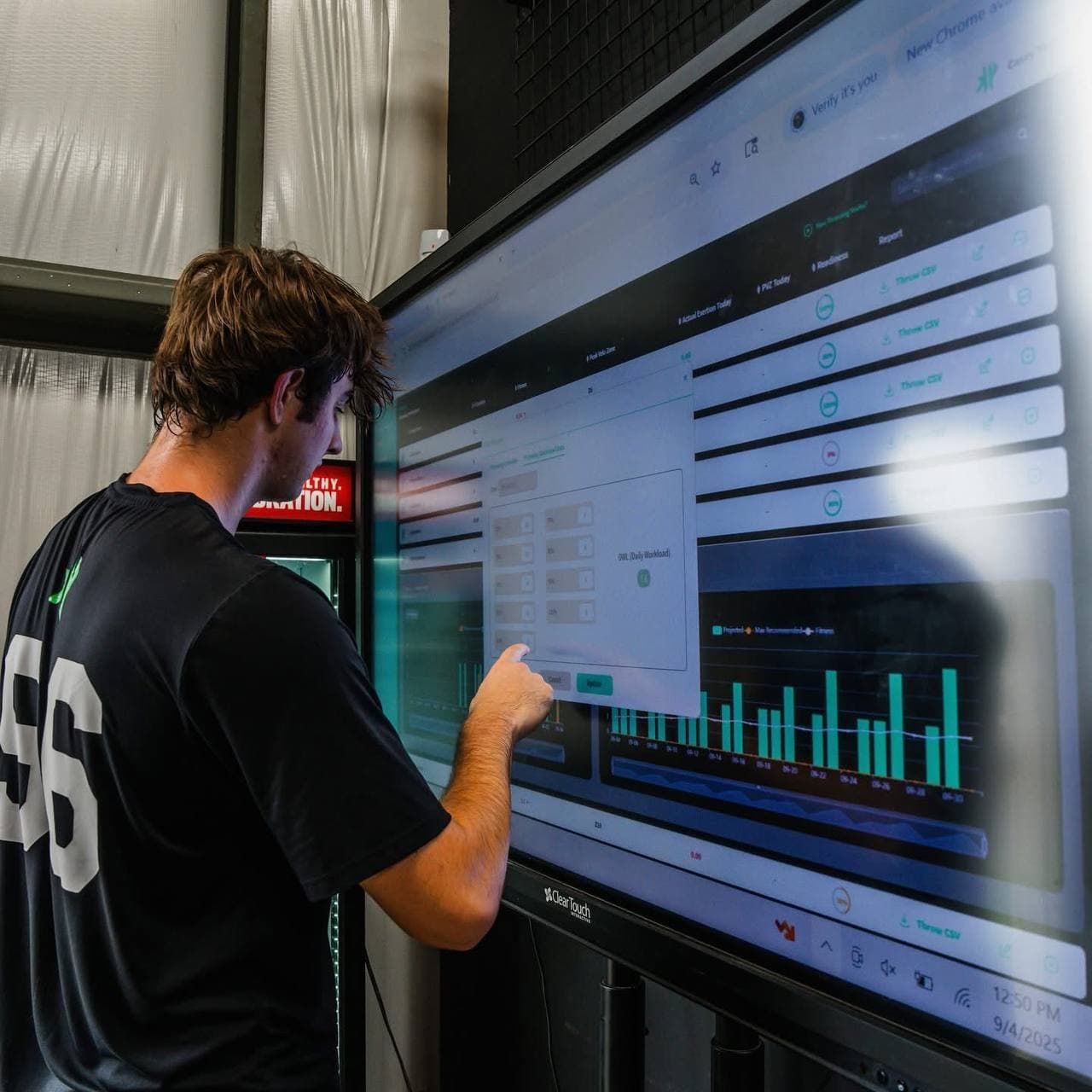 A player reviews his throwing workload on the facility touchscreen